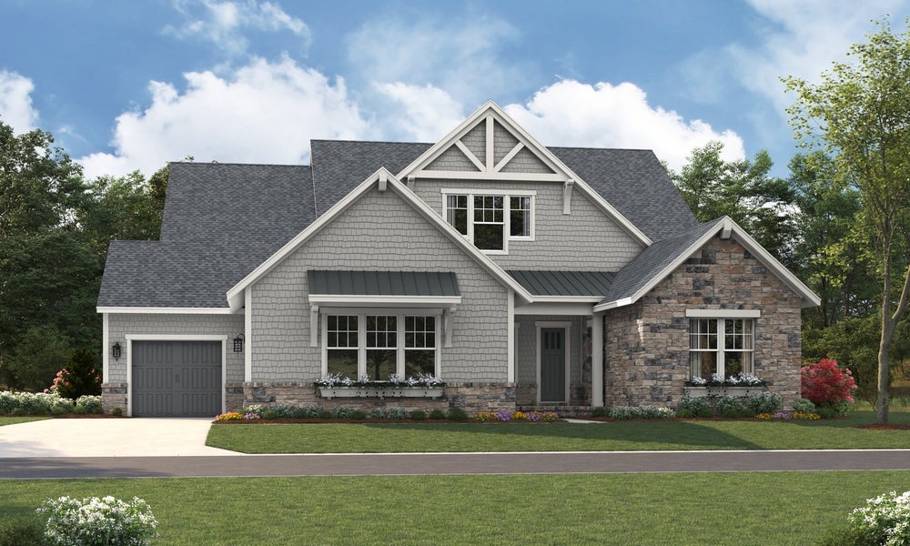 Single-story Craftsman home with gray shake siding, stone accents, and two-car garage
