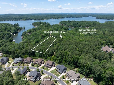 Aerial view of wooded lot on Youngblood Road near lake and residential neighborhood
