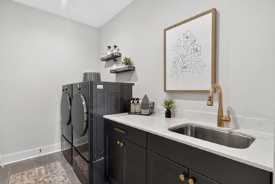 Enter the laundry room from the Primary Closet or the hall. Laguna Sur New Home Floor Plan