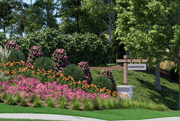 Neighborhood entrance sign surrounded by colorful flower beds and manicured landscaping