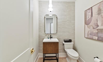 Half bath with tile wall. 4br New Home in Huntersville, NC