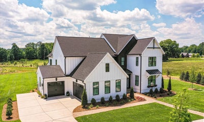 Napa Modern Farmhouse 3 car sideload garage. New Home in Huntersville, NC