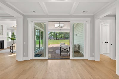 Dining opens into outdoor living. 3,734sf New Home in Huntersville, NC