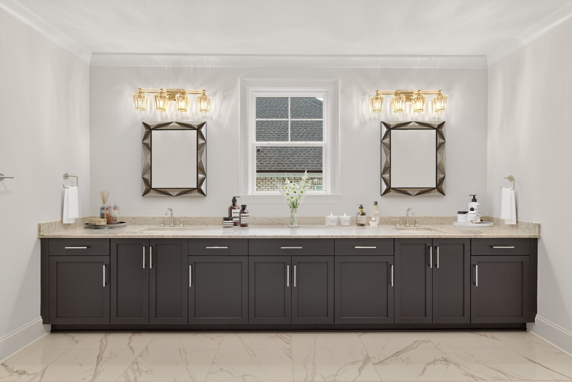 Master bathroom with double vanity, dark gray cabinets, and beige countertops