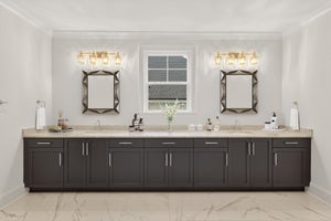 Master bathroom with double vanity, dark gray cabinets, and beige countertops
