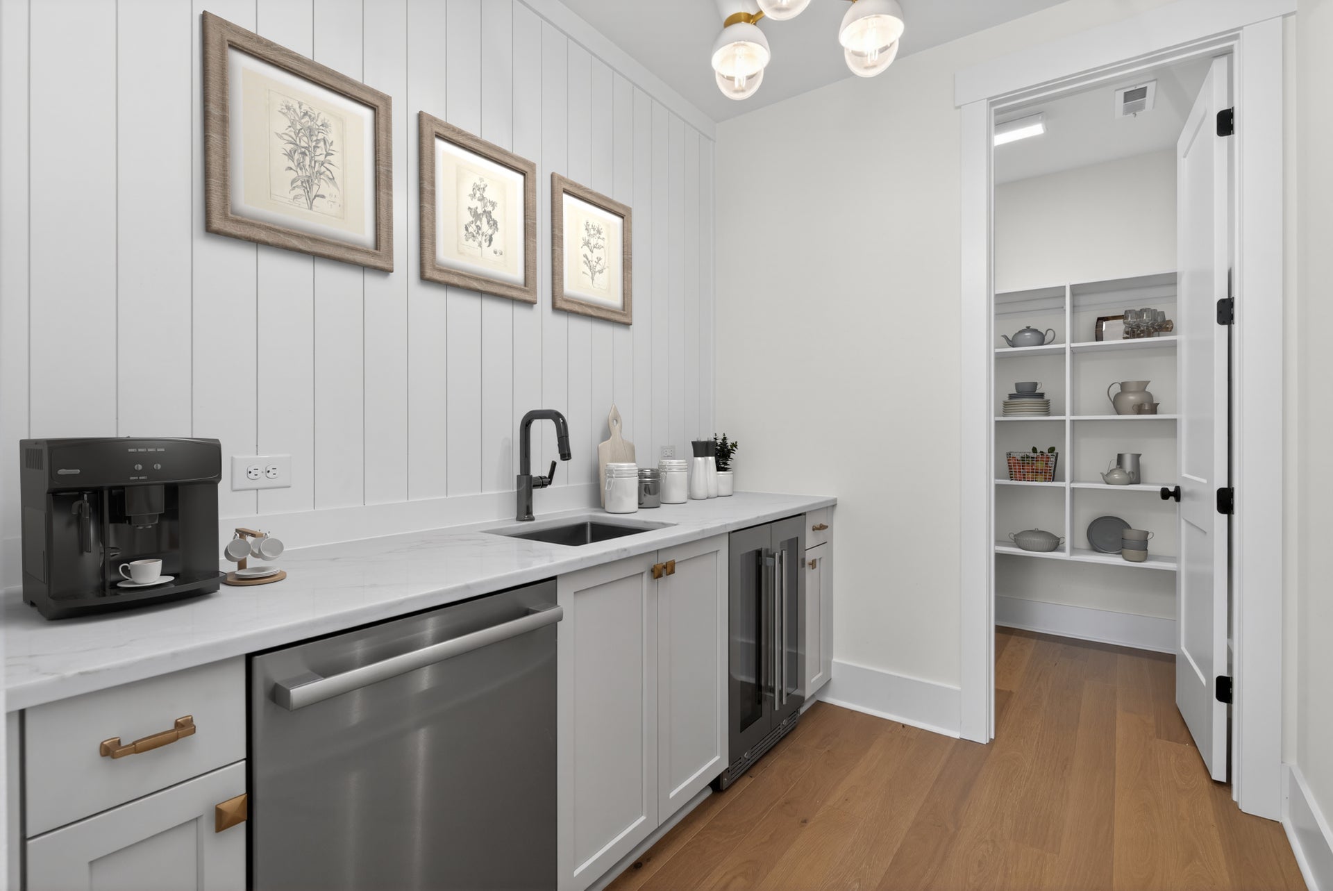 Butler's pantry with white shiplap walls, stainless appliances, sink, and open shelving in adjacent walk-in pantry