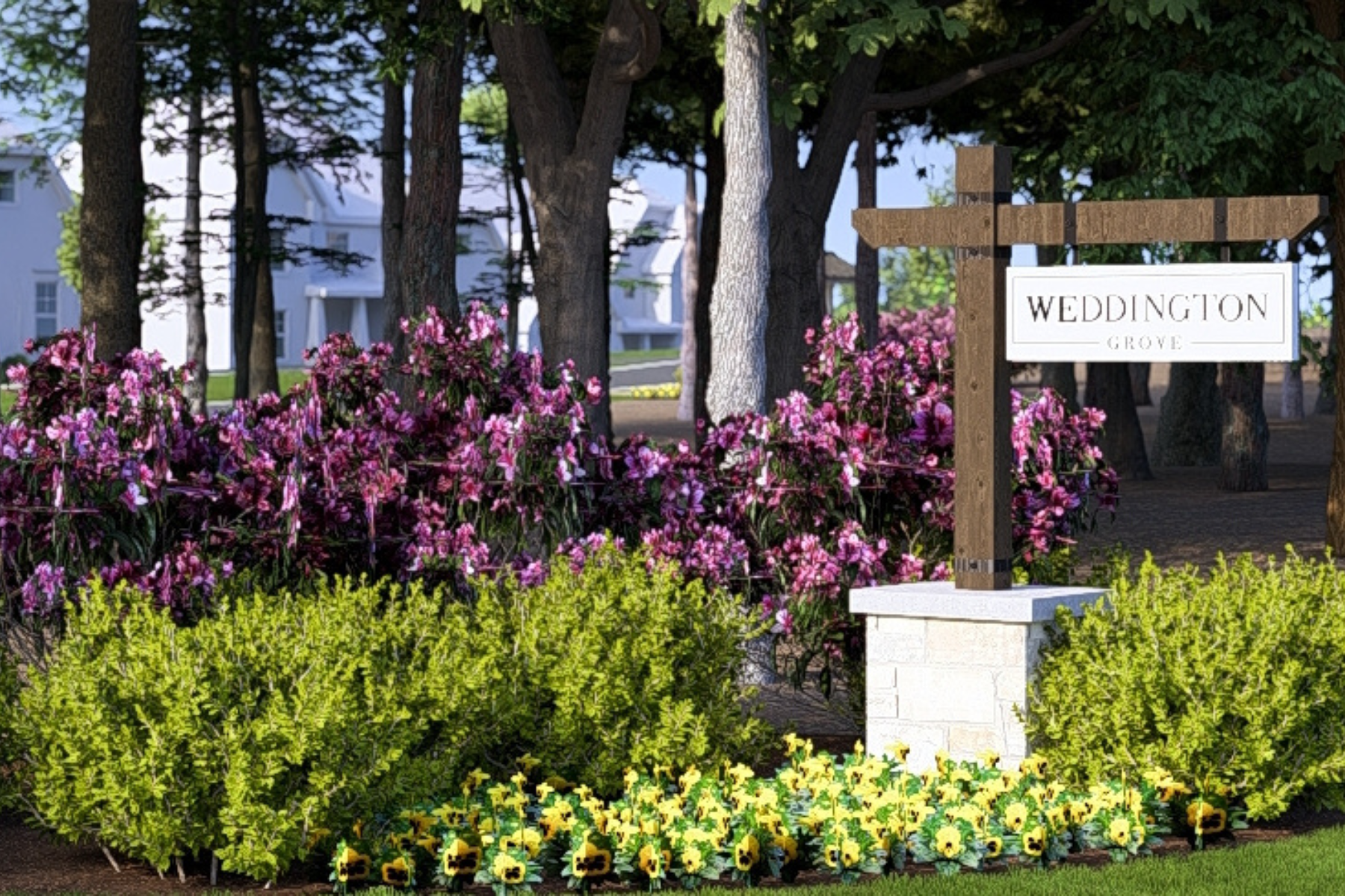 Weddington Grove community entrance sign on stone base surrounded by pink flowers and yellow pansies