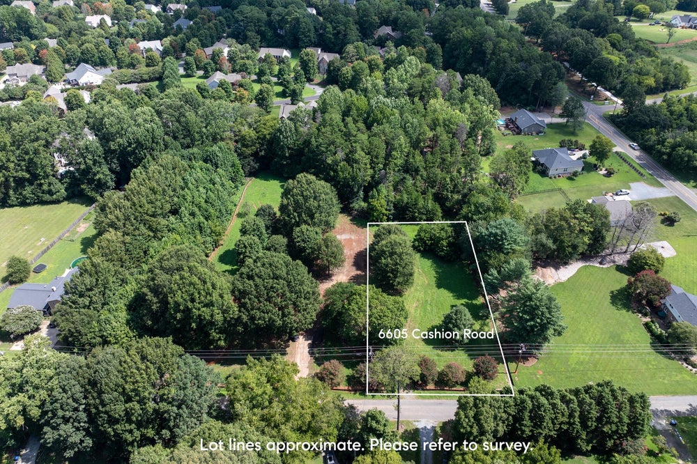 Aerial view of wooded residential lot at 6605 Cashion Road with approximate lot lines marked