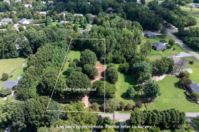 Aerial view of wooded vacant lot at 6535 Cashion Road with marked boundaries in a residential neighborhood