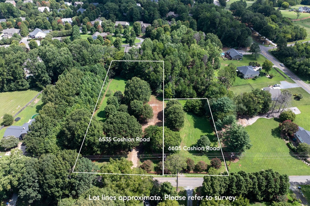 Aerial view of two wooded residential lots at 6535 and 6605 Cashion Road with marked lot lines in a suburban neighborhood.
