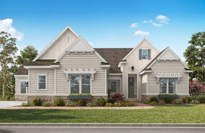 Single-story craftsman home with beige siding, stone accents, multiple gabled rooflines, and landscaped front yard