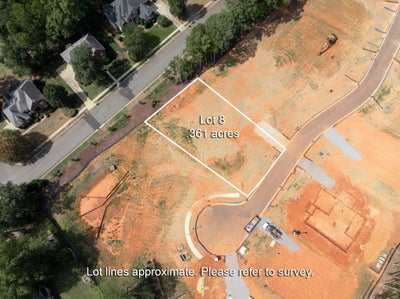 Aerial view of Lot 8, a 0.361-acre vacant residential lot in a new subdivision under development.
