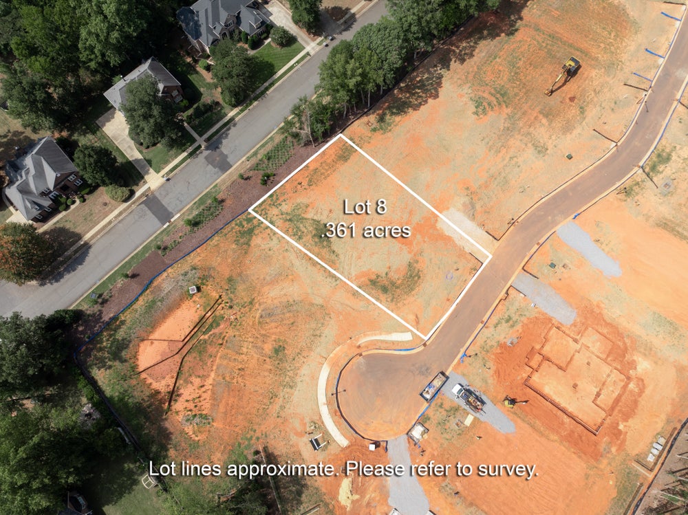 Aerial view of Lot 8, a 0.361-acre vacant residential lot in a new subdivision under development.