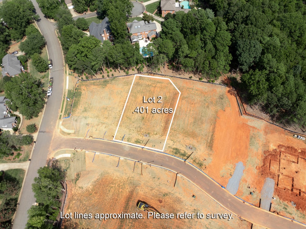 Aerial view of Lot 2, a 0.401-acre vacant residential lot with marked boundaries in a suburban neighborhood.