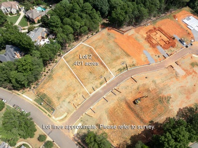 Aerial view of Lot 2, a 0.401-acre cleared residential building lot in a new subdivision near existing homes.